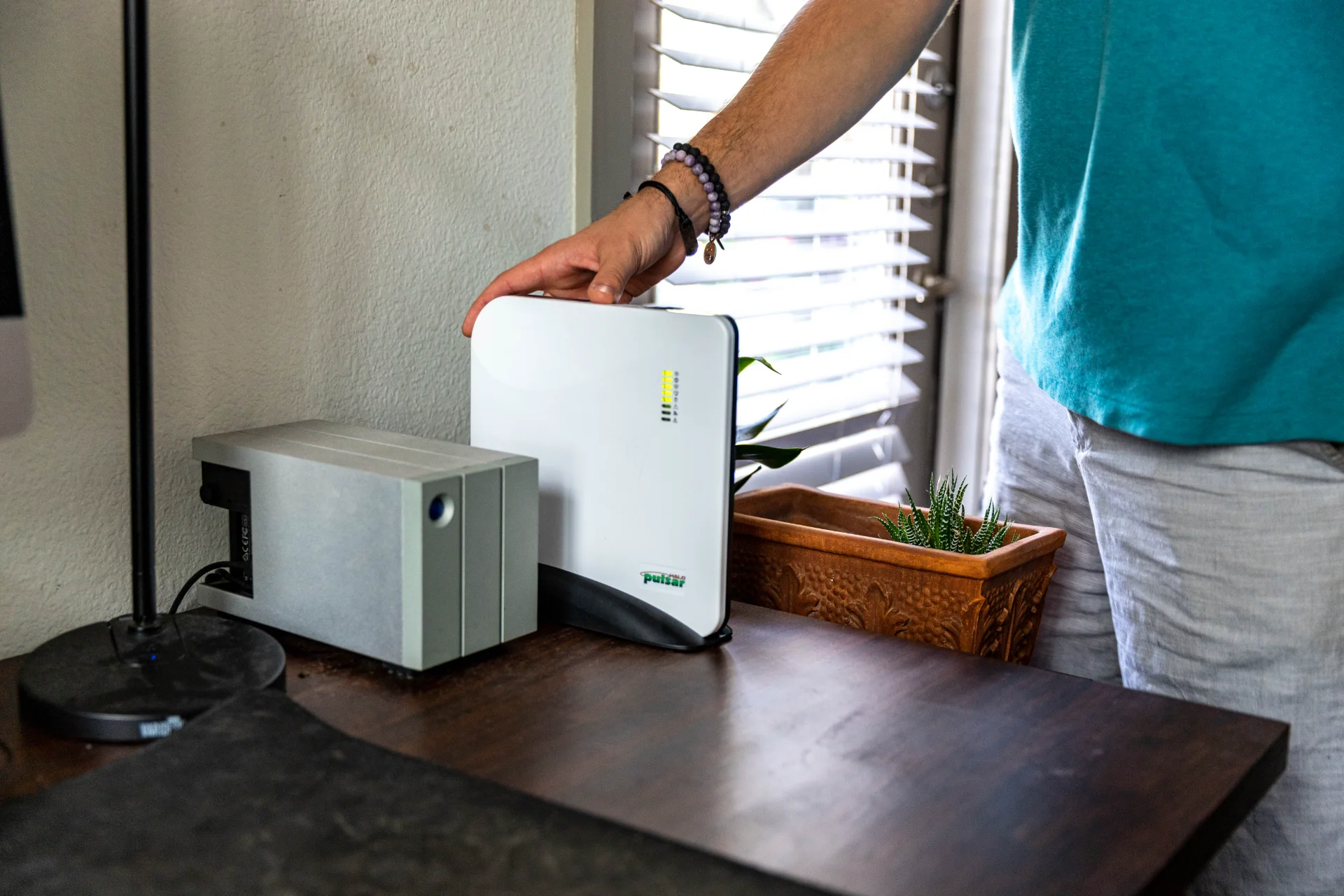 Person interacting with Pulsar security hub control panel